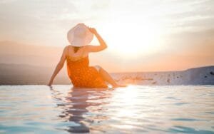 Woman relaxing by thermal pools at sunset in Pamukkale, Turkey