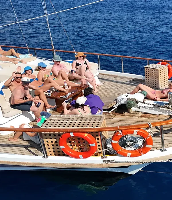 Travelers sunbathing and enjoying drinks on a Sail Turkey gulet deck