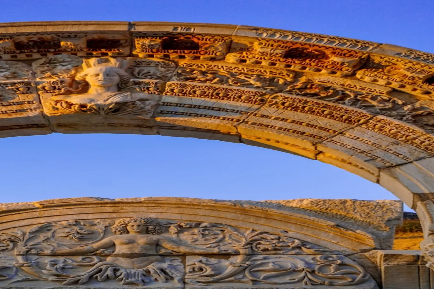 Intricate arch relief at the Temple of Hadrian in Ephesus
