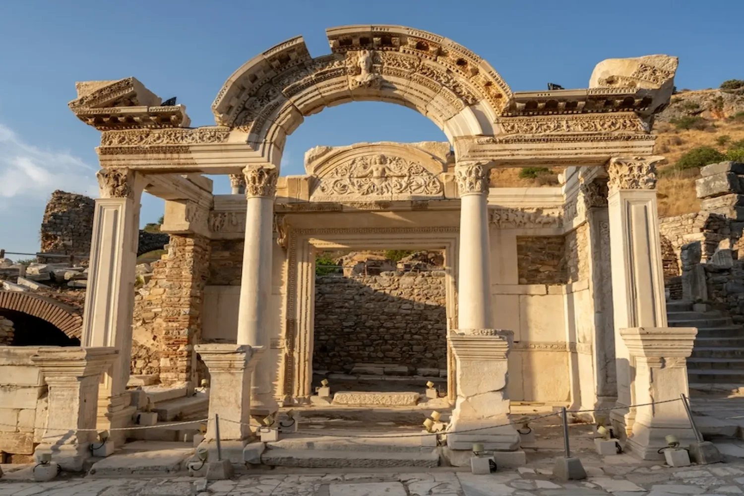 Ruined marble columns and arches in Ephesus ancient city archaeological site