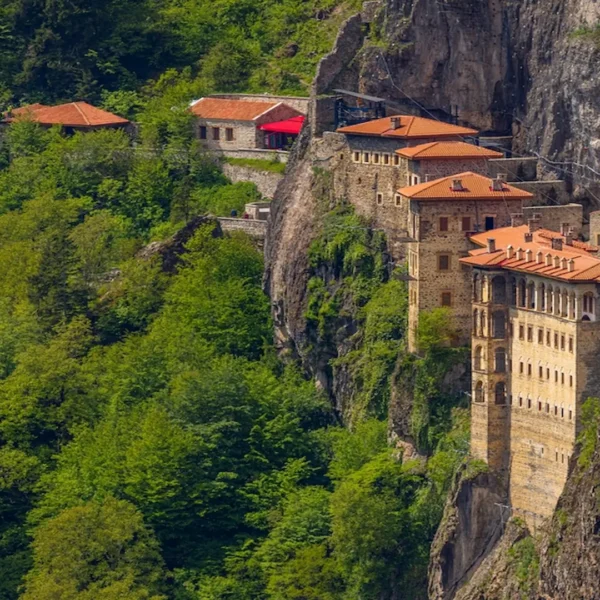 Sumela Monastery perched on steep cliffs surrounded by lush forest in Trabzon