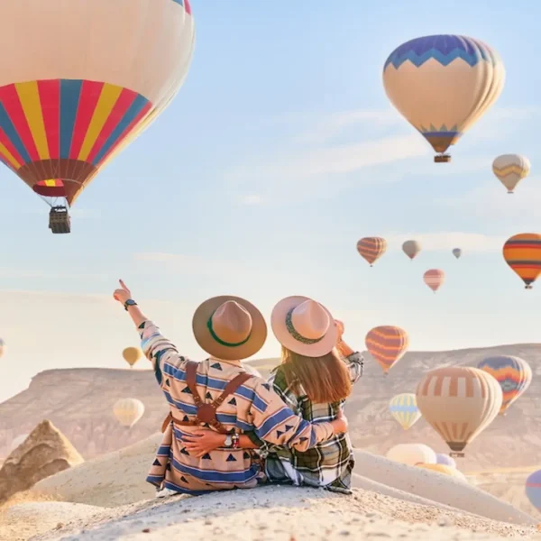 Couple enjoying a Cappadocia hot air balloon tour at sunrise