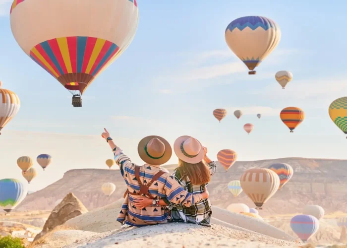 Couple enjoying a Cappadocia hot air balloon tour at sunrise