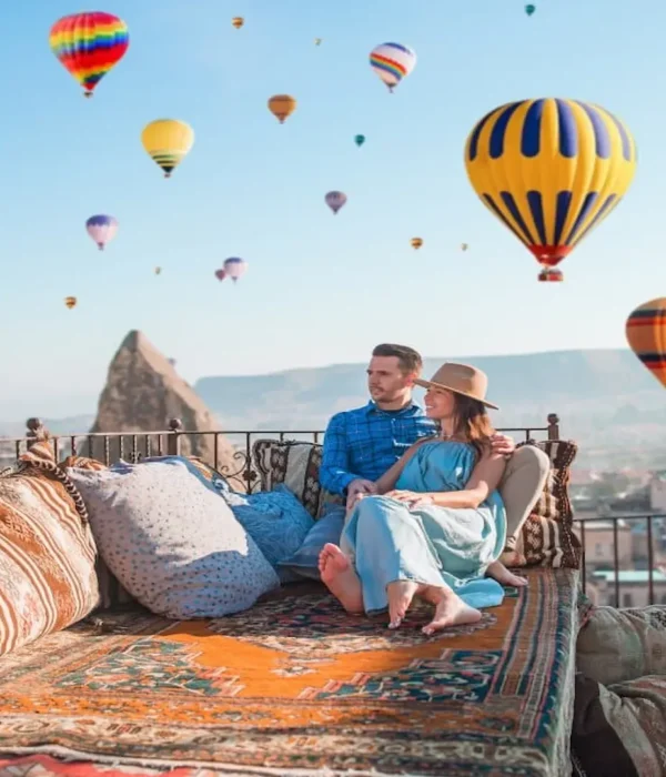 Hot air balloons flying over Cappadocia at sunrise