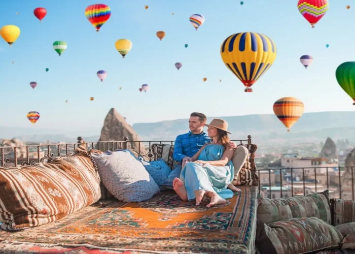Hot air balloons flying over Cappadocia at sunrise
