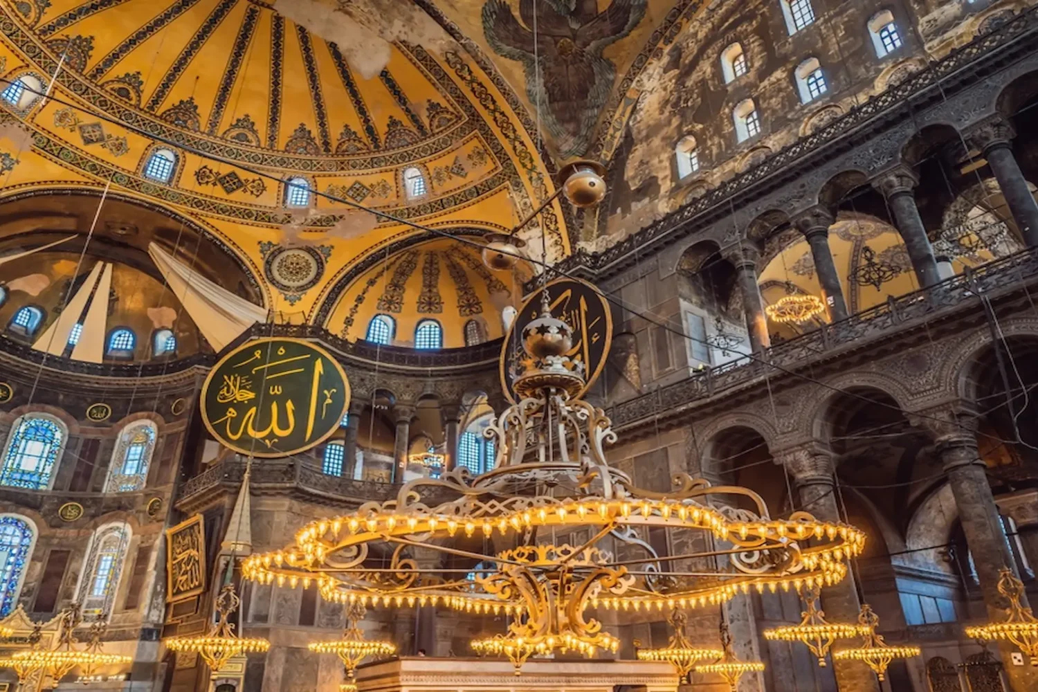 Interior view of Hagia Sophia with golden chandeliers in Istanbul