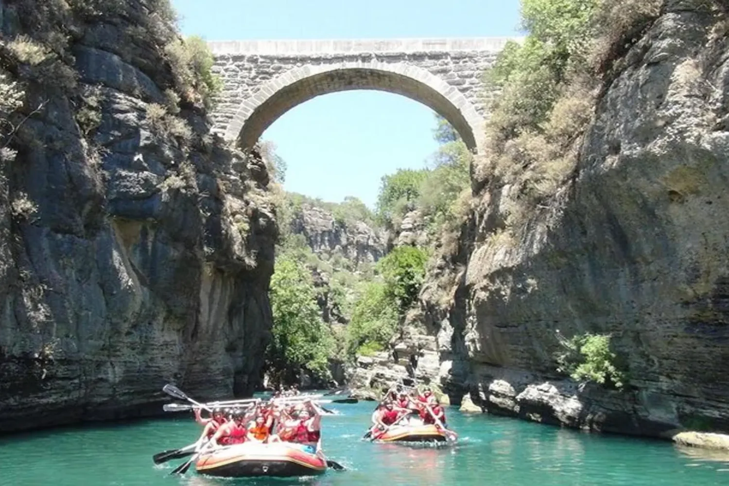 Rafting boats under Roman bridge in Koprulu Canyon Antalya