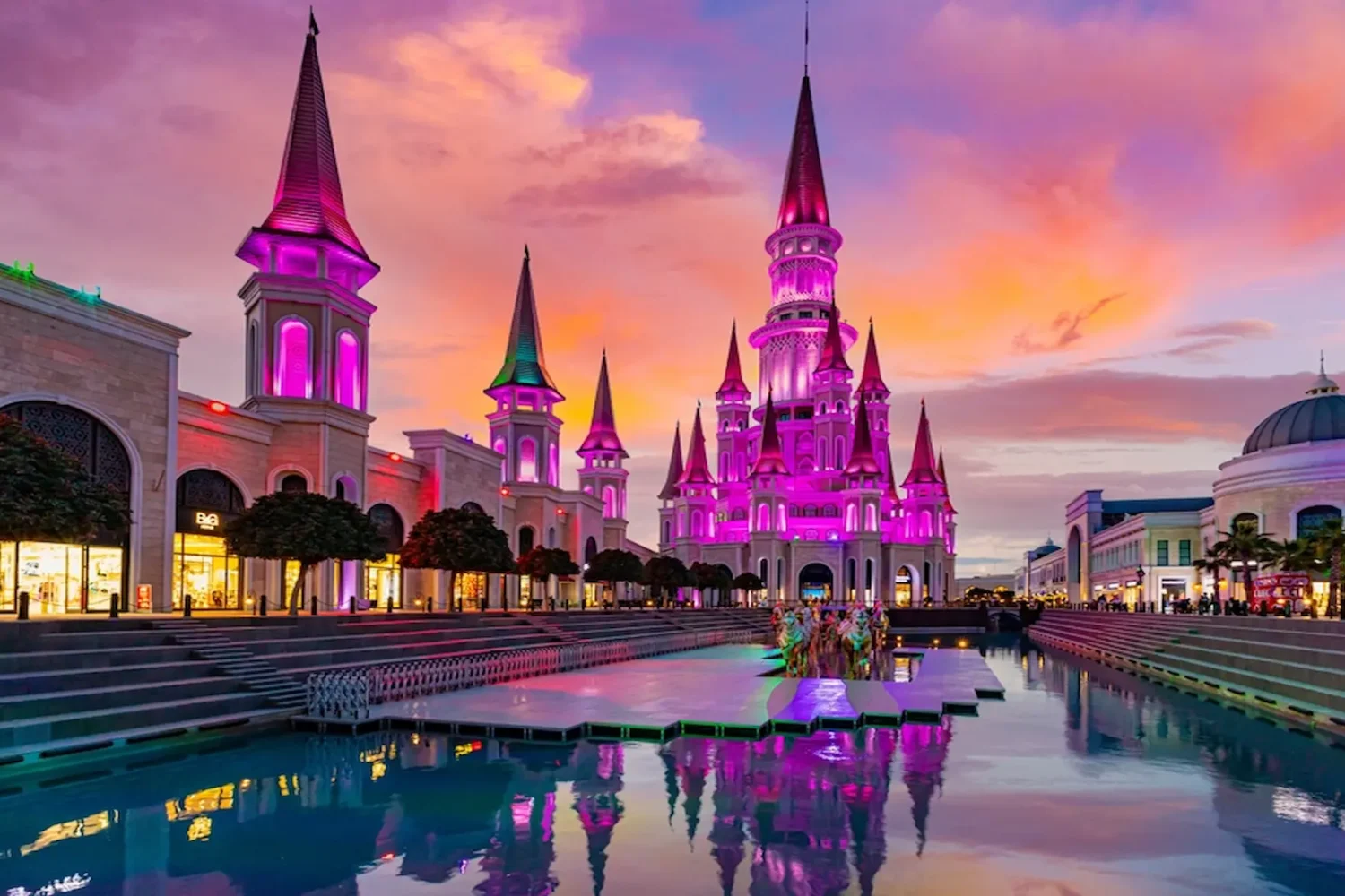 Colorful night lights on castle towers at Land of Legends Antalya