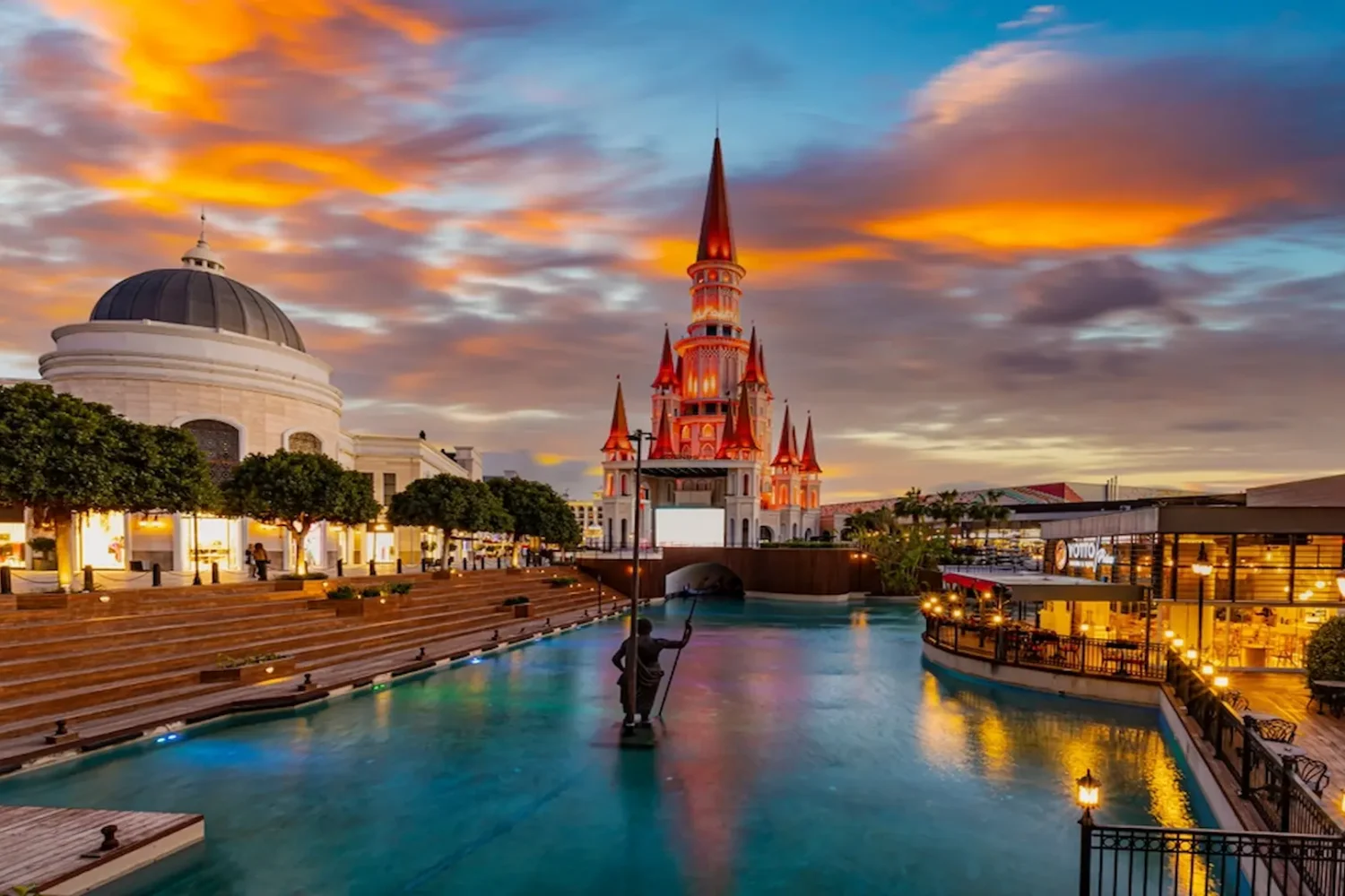 Illuminated fairy tale castle at Land of Legends Antalya during evening