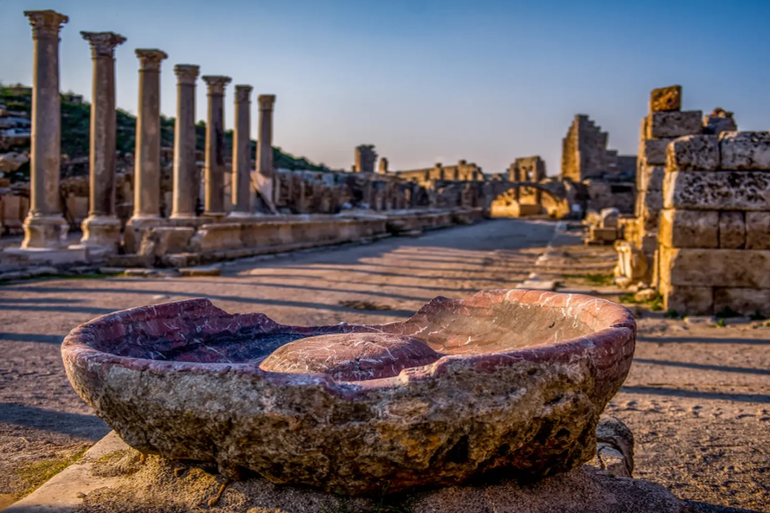 Ancient marble basin with colonnaded street in Side Antalya