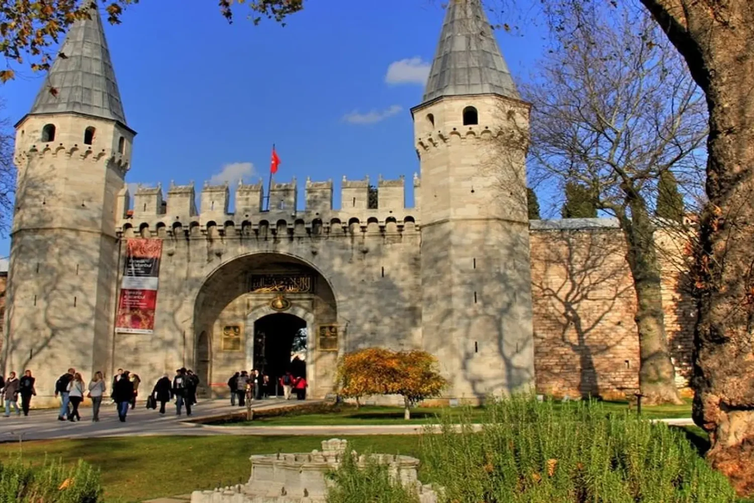 Topkapi Palace front entrance with two towers and garden