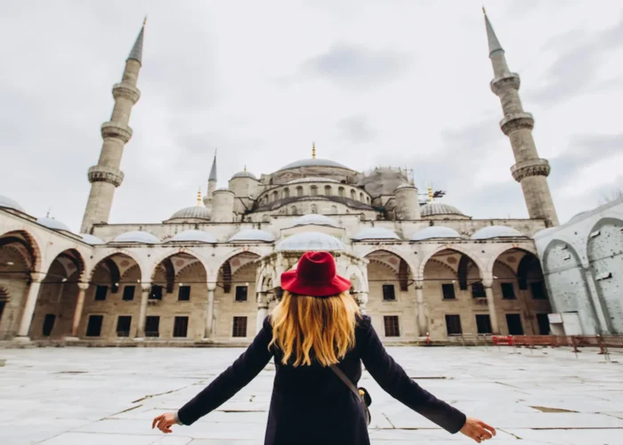 Visitor admiring the courtyard of the Blue Mosque in Istanbul