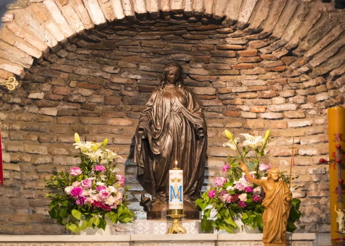 Virgin Mary shrine with flowers inside the house