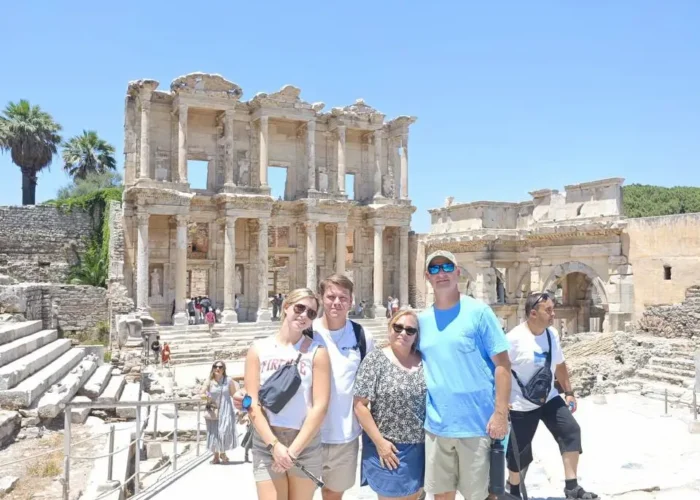 Visitors posing in front of the Celsus Library during an Ephesus tour