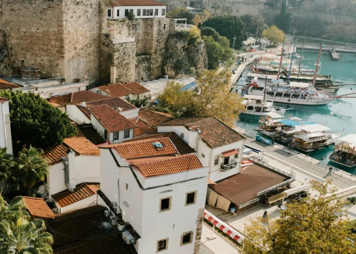 Antalya Old Town harbour with red-roofed houses and tour boats