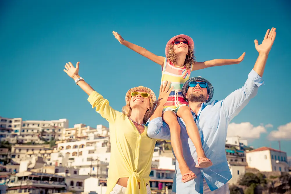 Family enjoying sunshine and blue skies during Turkey beach vacation