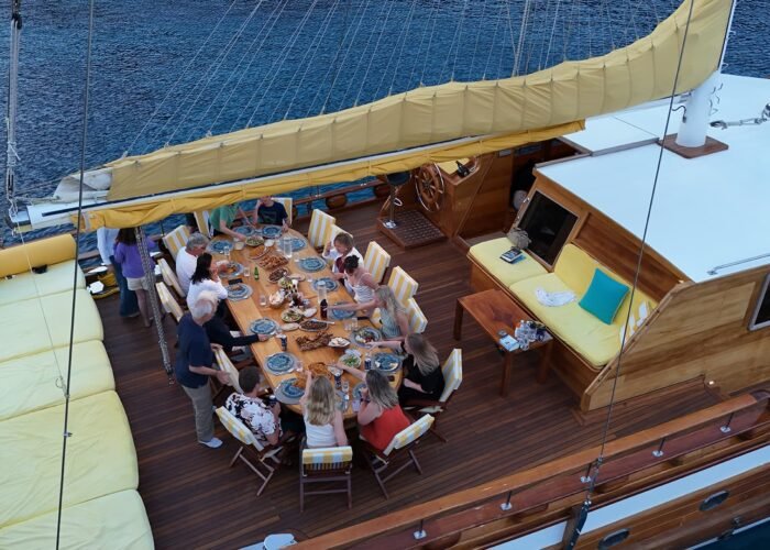 Guests sharing dinner on deck during Blue Cruise Turkey
