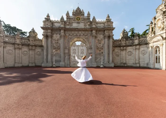 Whirling Dervish in front of Dolmabahce Palace Gate Istanbul