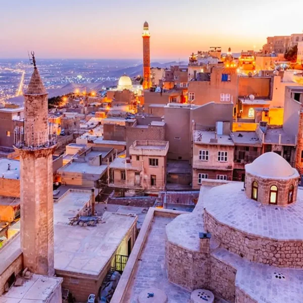 Sunset over stone rooftops and minarets in Mardin city
