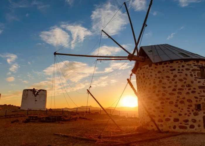 Historic Bodrum windmills with a golden sunset view