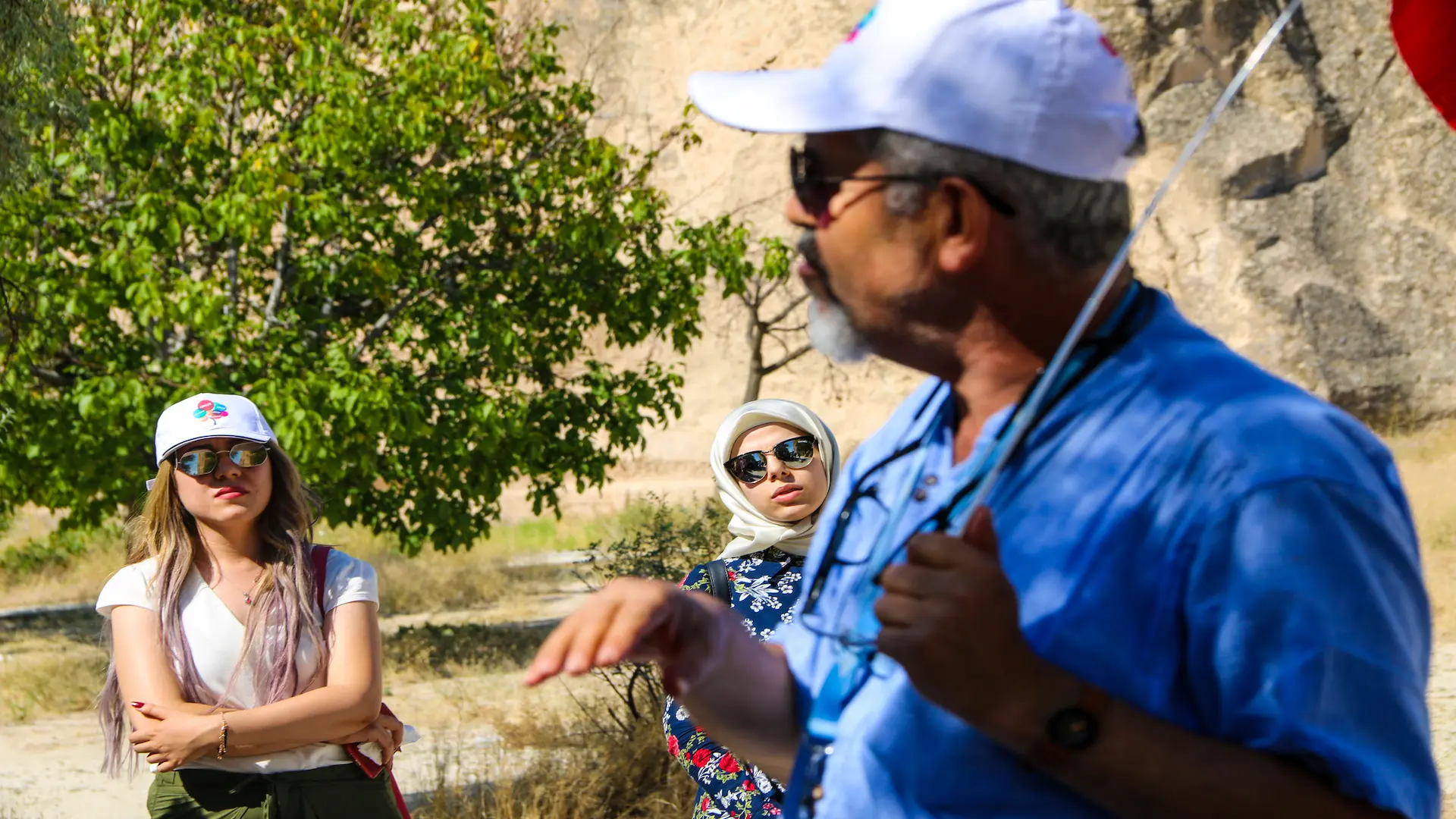 Local guide explaining Cappadocia’s history to tourists during a day tour