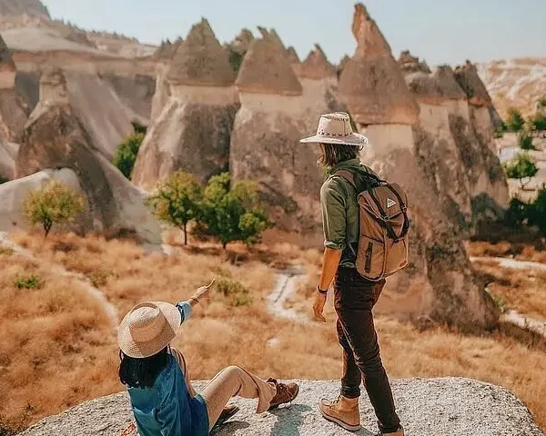 Traveler enjoying panoramic valley view in Cappadocia during a day tour