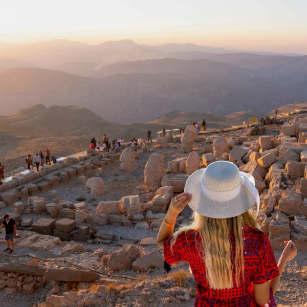 Tourists watching sunrise at Mount Nemrut archaeological site